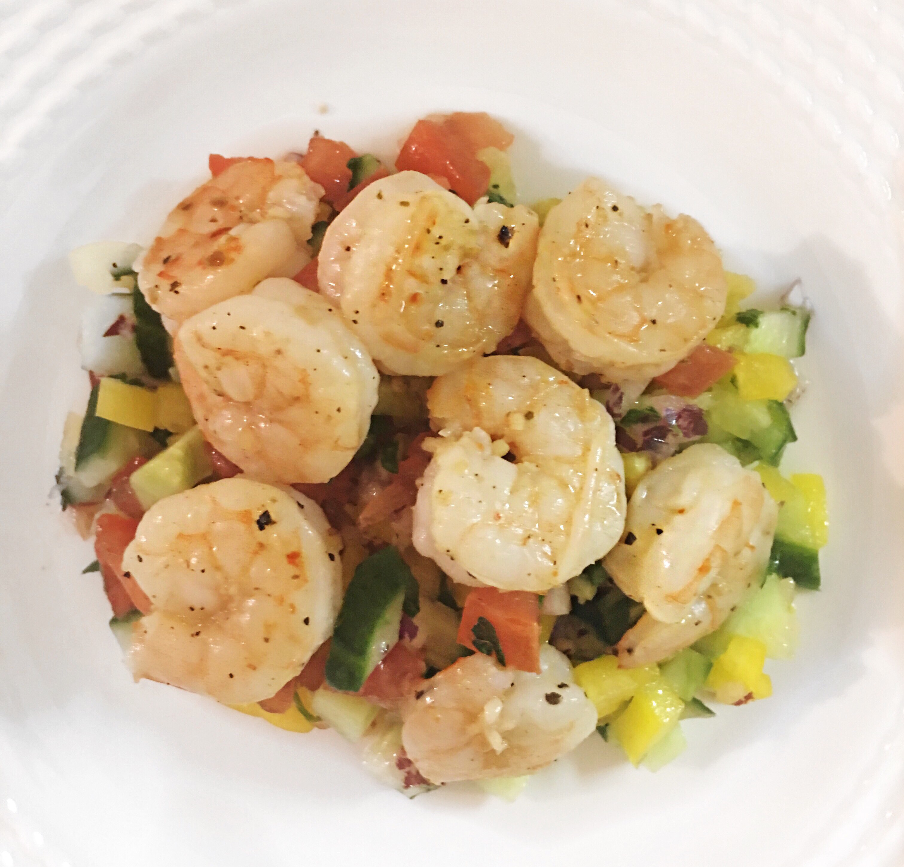 shrimp on top of chopped salad